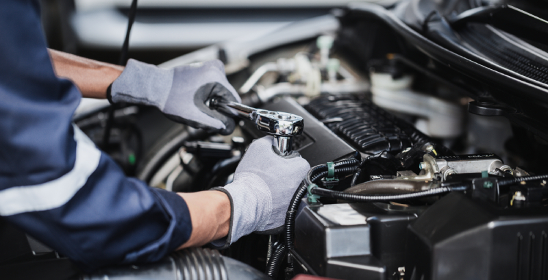 Cambridge-auto-mechanic-working-on-car-maintenance